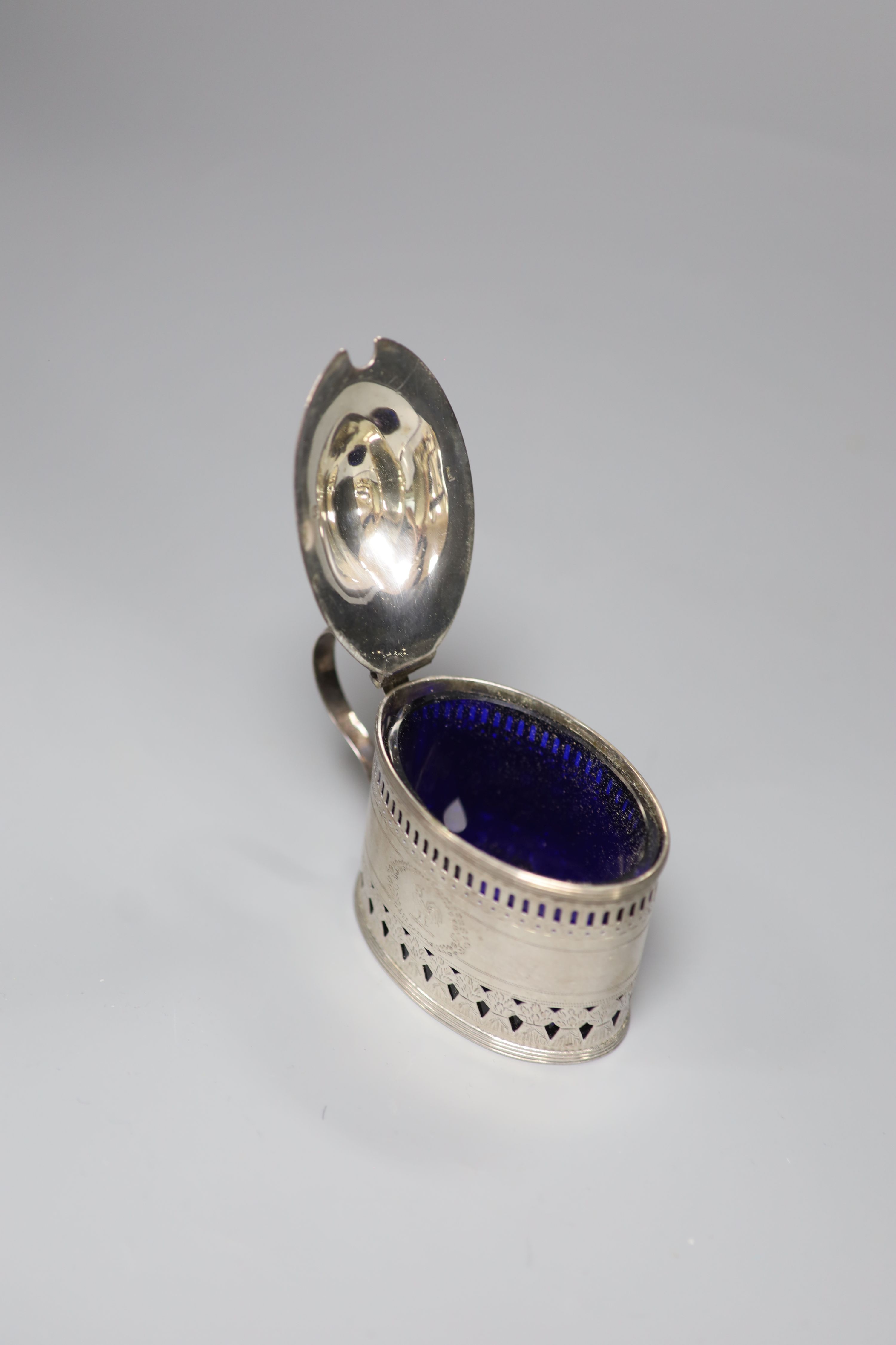 A George III pierced silver oval mustard, engraved with cockerel crest, Crispin Fuller, London, 1796